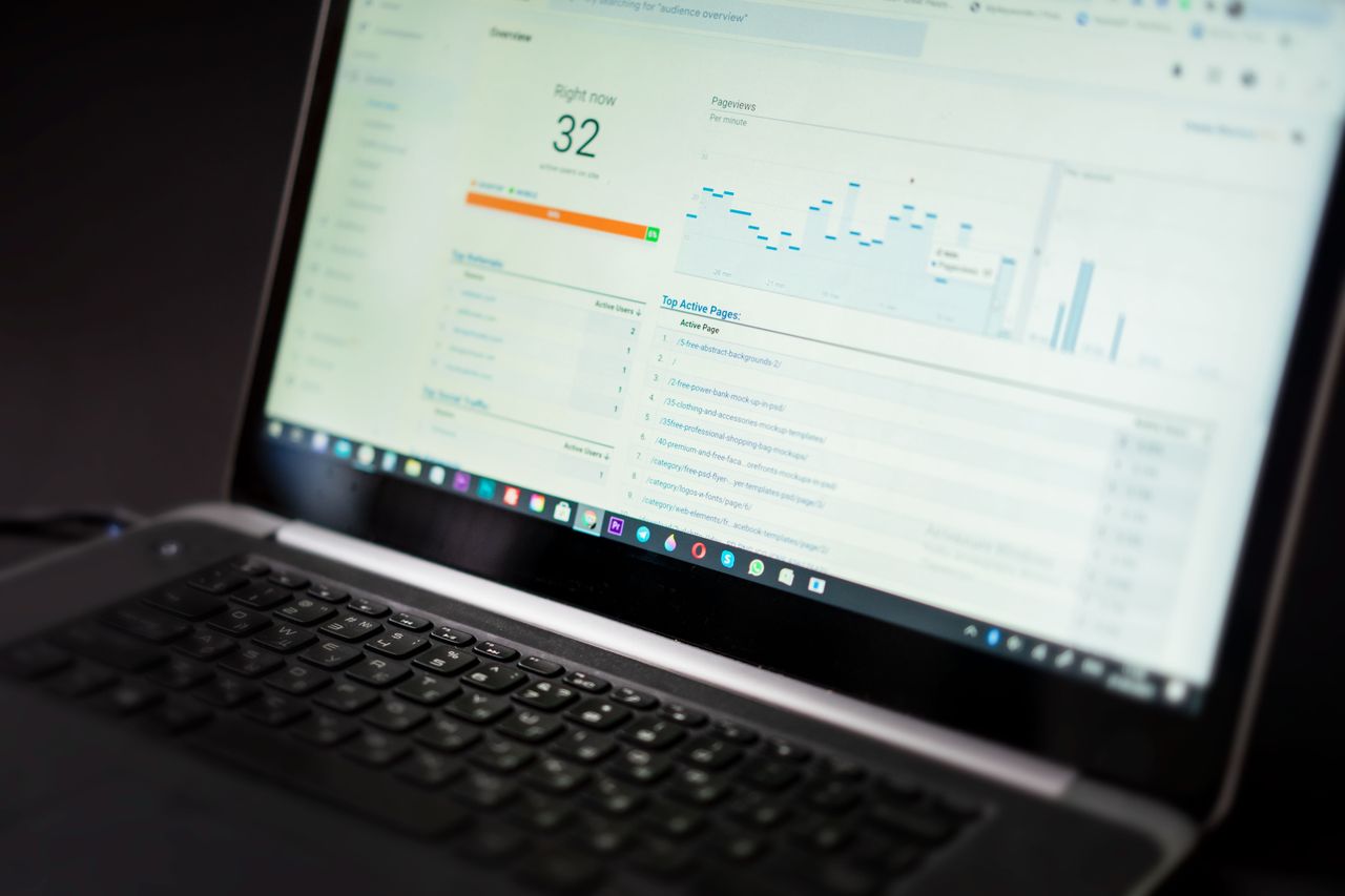 digital A laptop displaying an analytics dashboard with real-time data tracking and analysis tools.